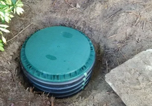 Placing-Septic-Cover-on-Riser-640w